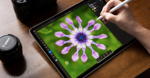 Photographer using Adobe Lightroom on an iPad Pro.